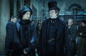 still of Tuppence Middleton and Joseph Quinn in Dickensian