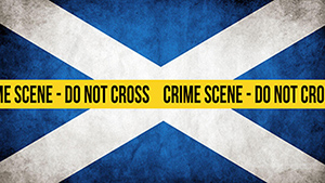 Scottish flag with police tape across it