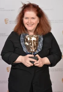 Sally Wainwright holding a BAFTA