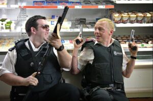 still of Nick Frost and Simon Pegg with guns drawn